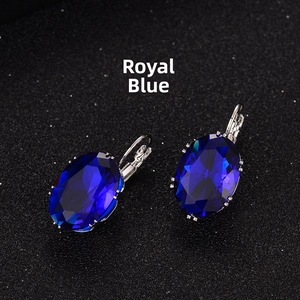 Detailed view of royal blue crystal earrings with silver lever-back setting