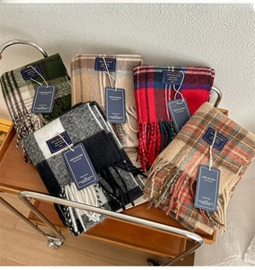 Classic British plaid scarves collection featuring thick tassel details and woven labels