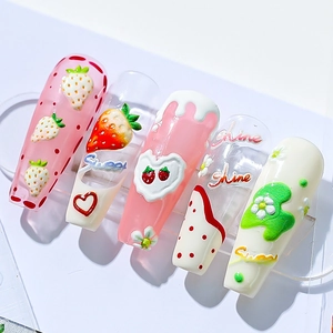 3D embossed strawberry press-on nails with floral and letter art in pink and white
