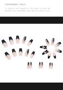 Detail of 3D black bow and shimmering silver glitter accents on long press-on nails