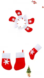 Detail of red and white Christmas stocking cutlery holders with snowflake patterns