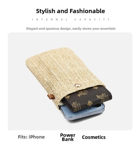 Detail of straw woven bag showing inner capacity with smartphone and printed wallet
