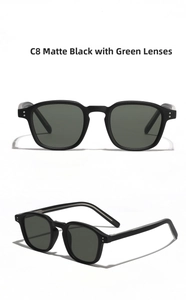Detailed close-up of matte black square frames and dark green lenses on sunglasses