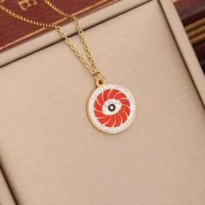 Golden chain necklace with red enamel eye pendant and rhinestones in a beige jewelry box