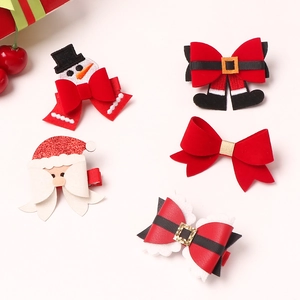Five assorted Christmas hair clips featuring Santa, snowman, and red bows on pink background