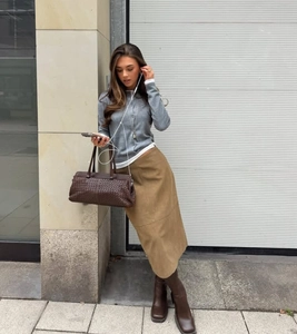 Fashionable high waist midi skirt in khaki suede with a sleek back slit detail