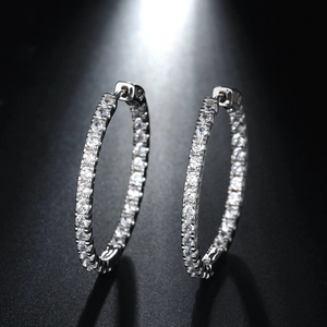 Close-up of hoop earrings in silver plating featuring pavé set cubic zirconia stones
