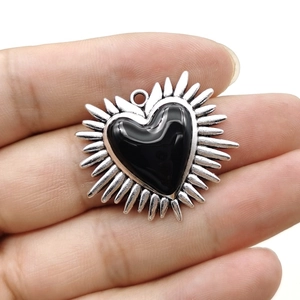 Vintage Gothic silver heart pendant with black gemstone and thorny wings detail