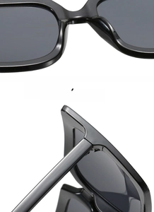 Detailed close-up of smooth polished black square frames and sturdy hinge structure