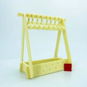 Detail of cream yellow acrylic earring organizer with 10 mini hangers and storage base