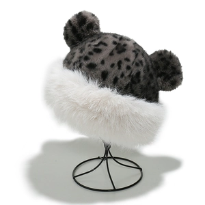 Detail of leopard print faux fur hat with bear ears and thick white plush lining
