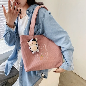 Pink corduroy tote bag with rabbit embroidery and a plush cow pendant for women