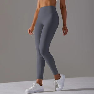 Detail of high-waisted gray yoga leggings showing seamless texture and soft fabric finish