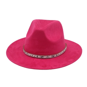 Detail of rose red fedora hat featuring snake skin band with sparkling rhinestone accents