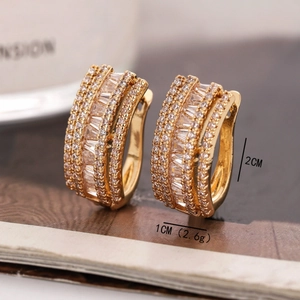 Detailed view of luxury gold earrings with cubic zirconia inlay and 2cm size specifications