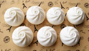 Detailed close-up of 6cm soft PU steamed bun stress relief toy with spiral texture