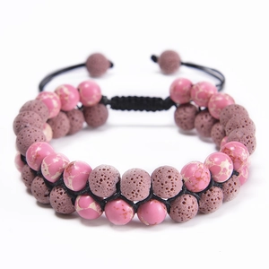 Close-up of double-layer woven bracelet with volcanic lava stone and purple spotted beads
