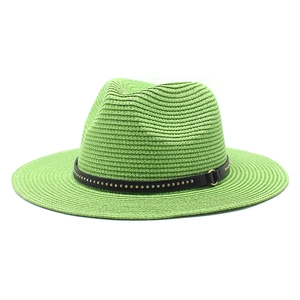 Close-up of neon green straw jazz hat with a black studded leather band detail