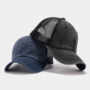 Close-up of vintage washed cotton baseball caps with breathable mesh back and curved brim