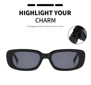 Detail of reinforced metal hinges on black rectangular retro sunglasses with grey lenses