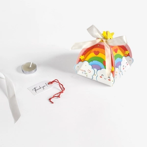 Rainbow cloud triangle gift boxes with beige ribbons and Good Luck greeting for parties