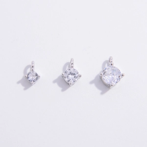 Three sizes of silver cubic zirconia pendants with four-prong settings and top rings