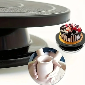 Close-up of black rotating cake turntable showing textured surface and pottery applications