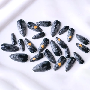 Long almond press-on nails with grey gradient, honeycomb patterns and honey bee designs
