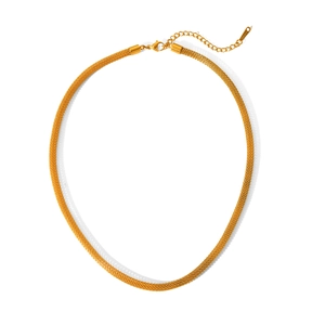 Detail of golden woven mesh necklace with lobster clasp and S-Steel logo tag