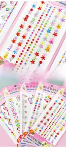 Close-up of colorful DIY self-adhesive crystal gem stickers in star and heart shapes