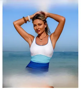 Detail of blue tricolor swimsuit featuring decorative wavy scalloped edge and matching belt