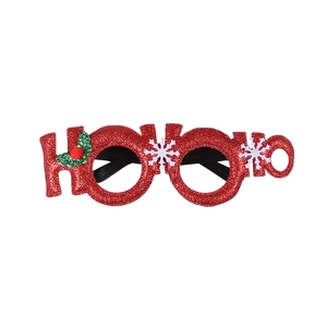 Close-up of glittery red HO HO HO Christmas glasses with festive holly and snowflake details