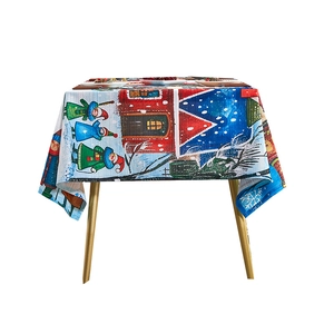Christmas tablecloth with snowy cabin and gnome print for festive dining table decoration