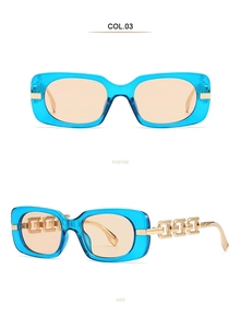 Detail view of light blue transparent sunglasses with gold hollow chain metal temples
