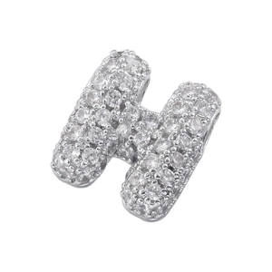 Macro detail of silver letter H pendant with 5A cubic zirconia stones for jewelry DIY