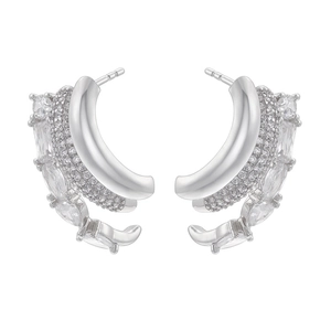 Macro detail of silver C-shape multi-layer earrings with marquise and pave crystals