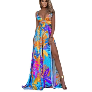 Detail view of tropical leaf print on bohemian summer maxi dress with side split