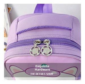 Detail view of smooth metal ring zippers on a durable purple cartoon kid backpack