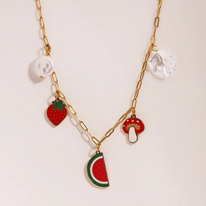 Gold chain necklace with fruit and pearl charms including strawberry watermelon and mushroom
