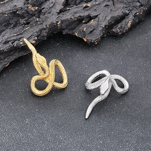 Vintage punk style snake pendant in gold and silver finish with detailed scale texture