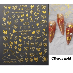 Detail view of CB-202 gold 3D nail stickers featuring love hearts and rose patterns