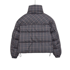 Back view of short quilted puffer jacket with stand collar and plaid pattern in monochrome
