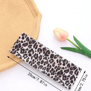 Flat leopard print headband dimensions shown as 20cm long and 7cm wide for yoga and sports