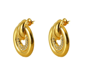 Detail of gold-plated intertwined circular earrings featuring pavé set rhinestones