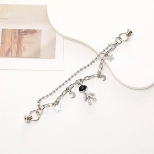 Dual-layer silver chain bracelet with astronaut and star charms featuring magnetic clasps