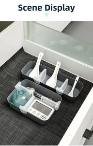 Close-up of adjustable divider in gray refrigerator storage drawer for kitchen organization