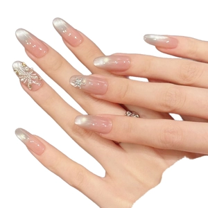 Pink gradient press-on nails with silver cat-eye effect and snowflake pearl accents