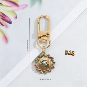 Detailed view of evil eye keychain with rhinestones and precise size measurements