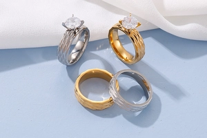Detailed view of titanium steel rings set with diamond zircons and scale texture surface
