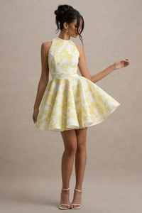 Detail of yellow floral print A-line dress with halter neck and waist tie ribbon